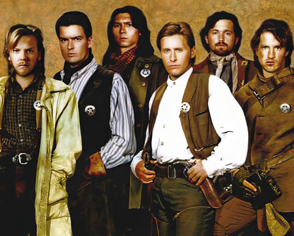 A group portrait of five men dressed as bounty hunters, styled like the Star Wars Rebel Alliance, standing against a textured brown background. They wear matching vests, utility jackets, and badges with a skull emblem.