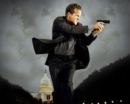 A man in a dark suit holding a handgun in a dramatic pose, set against a cloudy sky with the U.S.