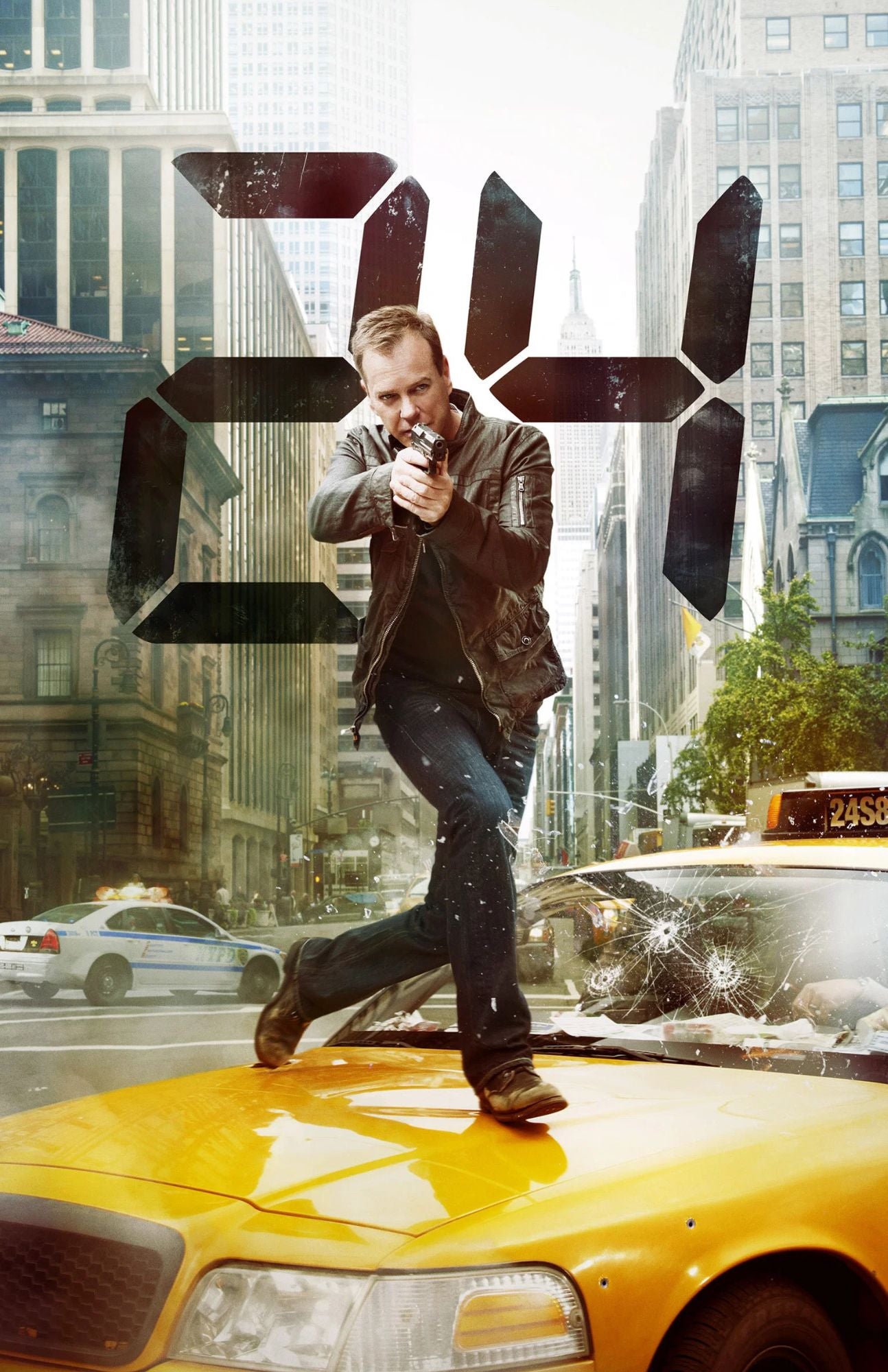 A man in a brown leather jacket and dark jeans stands on the hood of a yellow taxi in a city street, holding a handgun. A large black digital clock graphic overlays the scene, with buildings and other cars visible in the background.