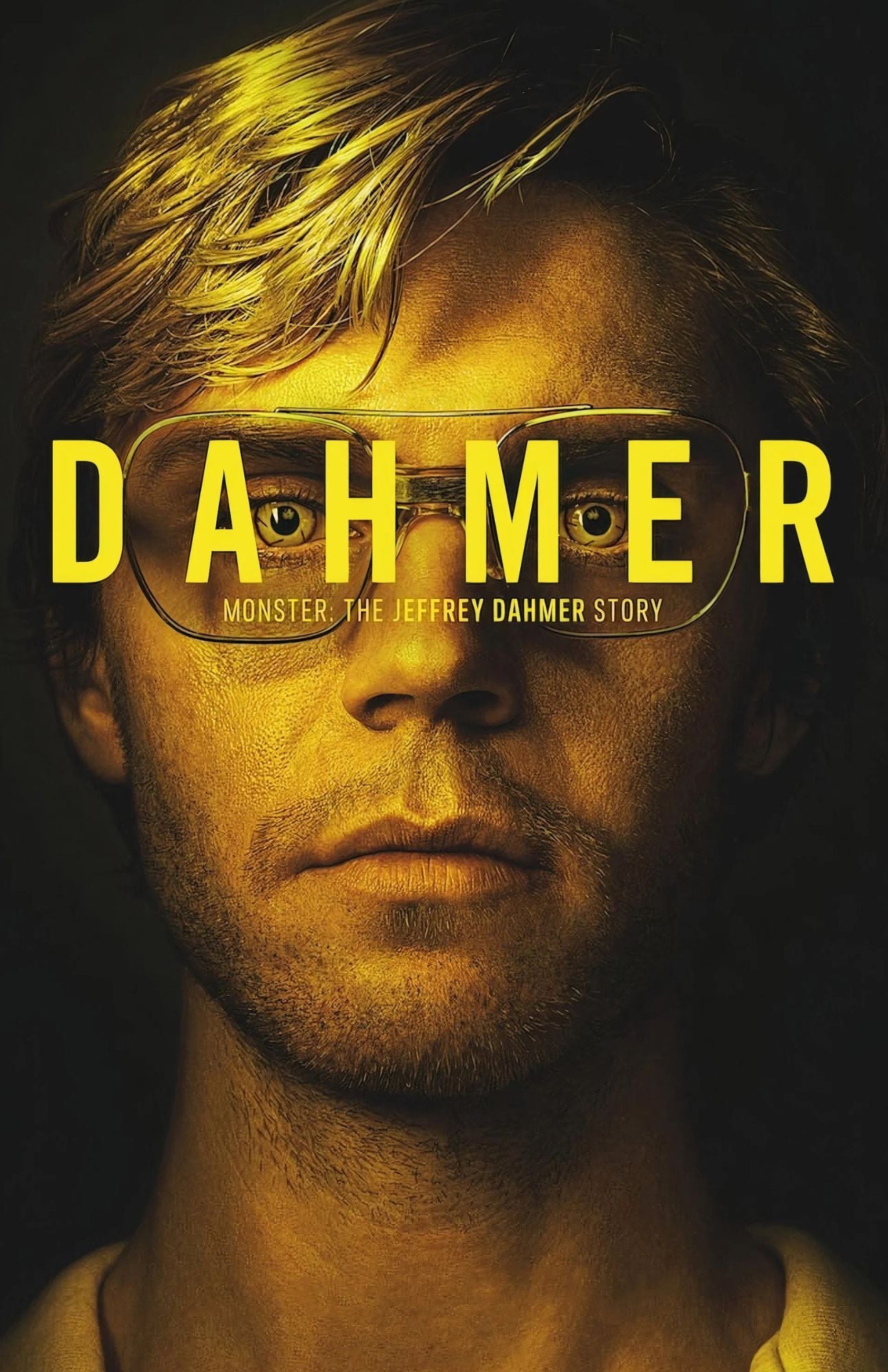Poster for 'DAHMER: Monster the Jeffrey Dahmer Story' featuring a close-up portrait of a man with blond hair and aviator-style glasses, lit in dramatic yellow light against a dark background, with the title in large yellow text across the face.