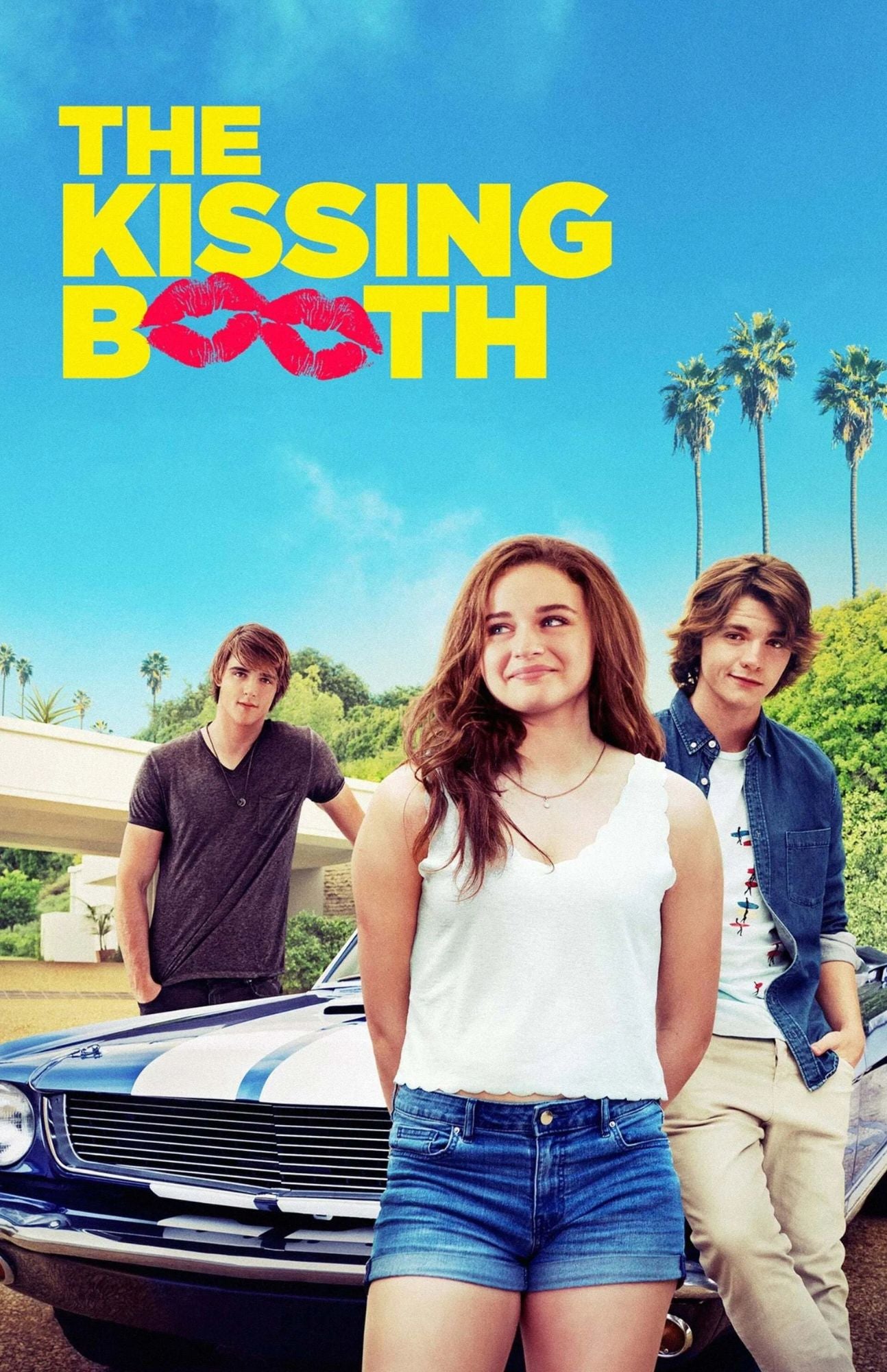 Movie poster for 'The Kissing Booth' featuring three young adults standing in front of a classic car under a bright blue sky with palm trees. The title is displayed in large yellow letters at the top with red lips integrated into the word 'booth'.