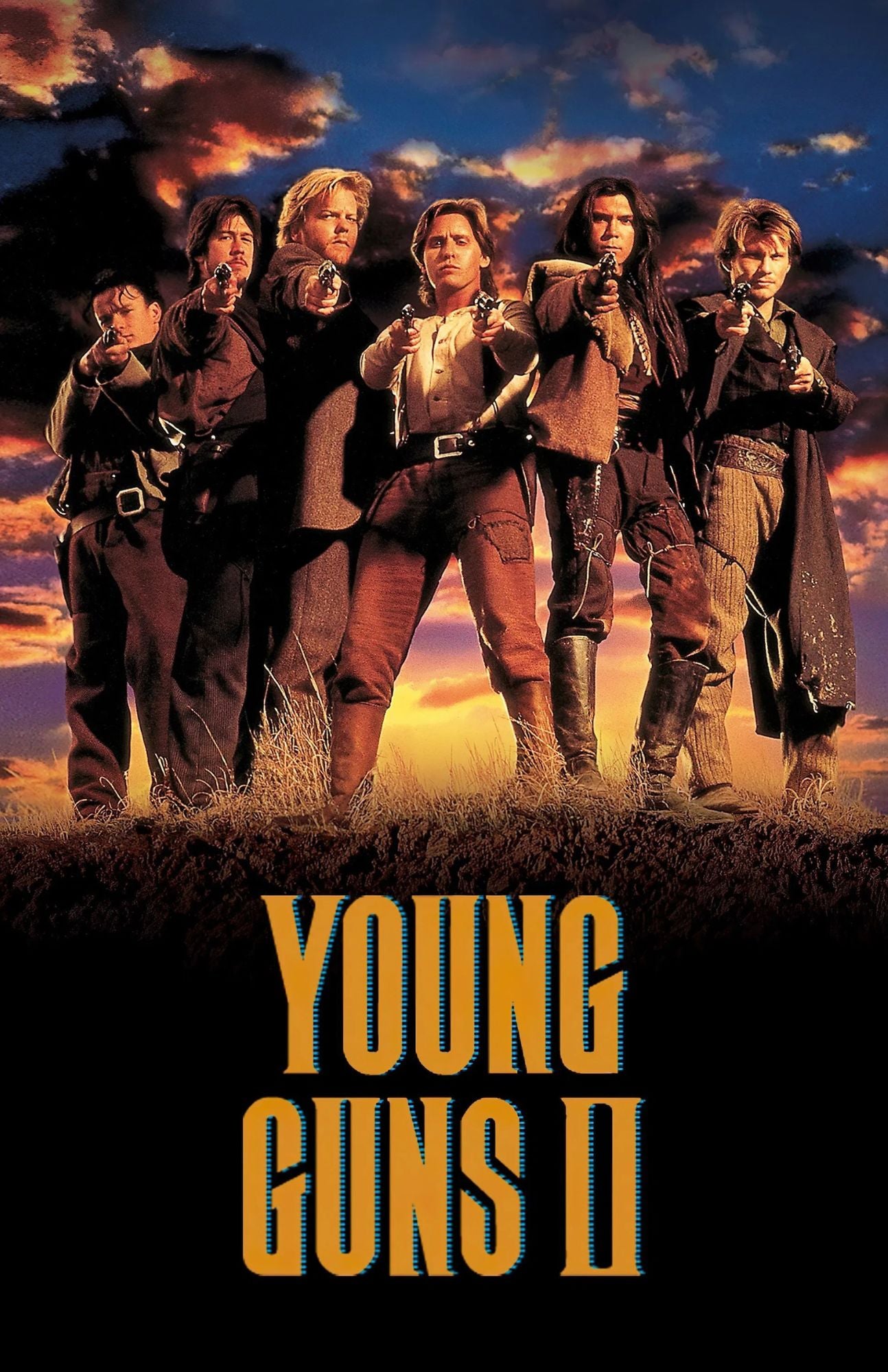 Movie poster for Young Guns II featuring five women in western outfits standing in a field with guns drawn, against a dramatic sunset sky, with the title 'YOUNG GUNS II' in large yellow text at the bottom.