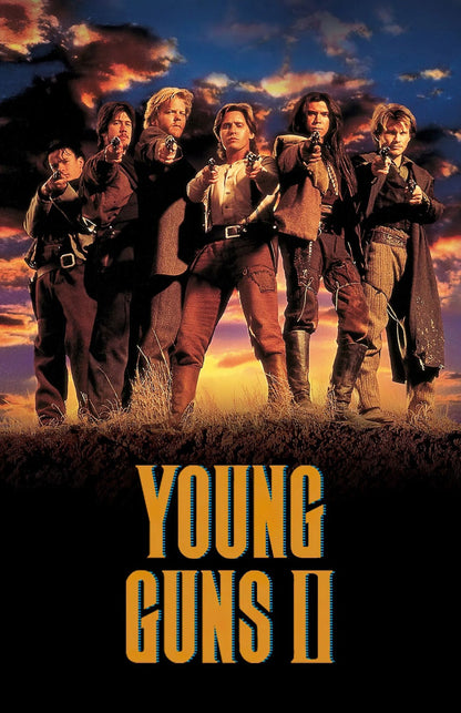 Movie poster for Young Guns II featuring five women in western outfits standing in a field with guns drawn, against a dramatic sunset sky, with the title 'YOUNG GUNS II' in large yellow text at the bottom.